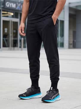 Magnify Nitro 3 – A streetwear-inspired look featuring black tapered cargo joggers, a crisp white oversized t-shirt, and a lightweight black windbreaker.