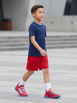 Marvel Spiderman Adizero Impact Turf Kids Shoes – A navy blue moisture-wicking athletic t-shirt paired with matching red mesh sports shorts and white crew socks for a complete field-ready look.