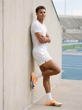 An aerodynamic white racing jersey and matching shorts, allowing the bold orange spikes to be the focal point of the kit.