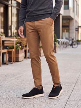 Mens 2zergrand Stitchlite Wingtip Oxfords – Style with tan tapered chinos and a charcoal grey lightweight merino wool sweater for a comfortable yet polished office outfit.