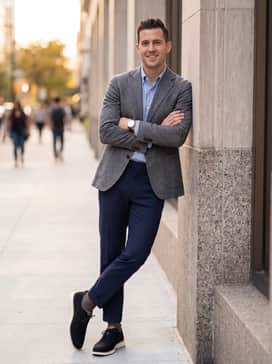 Mens 2zergrand Stitchlite Wingtip Oxfords – Style with navy blue tailored trousers and a patterned blazer in grey or blue, skipping the tie for a relaxed but sharp 'Casual Friday' ensemble.