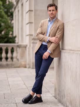 Mens Riginalgrand Cityspectre Wholecut Oxfords – Tapered navy chinos, a light blue oxford shirt, and a tan unstructured blazer for an effortless business-casual ensemble.