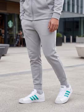 Style with light grey tapered tech joggers and a matching zip-up hoodie for a sleek, coordinated athleisure ensemble perfect for travel or weekend errands.