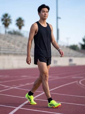 Metaspeed Ld 2 Paris – A minimalist black racing singlet and ultra-lightweight split shorts for a high-performance competition look.