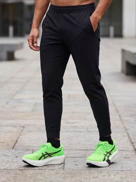 Modern Athleisure: Combine with tapered black joggers and a fitted grey heather technical hoodie for a sleek, comfortable outfit perfect for traveling to a race or a casual gym session.