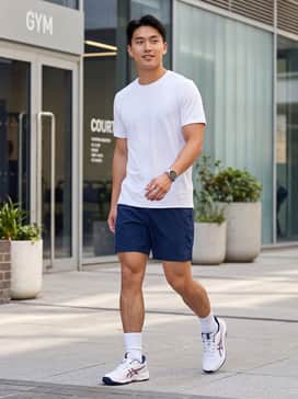 Performance court look: Navy technical shorts, a moisture-wicking white compression tee, and high-performance crew socks in white to match the base of the shoe.