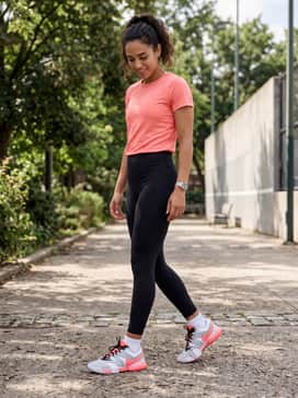 Sleek black high-waisted leggings and a grey cropped zip-up hoodie to make the bright pink accents of the shoes the focal point.