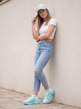 Casual summer streetwear: Style with light-wash cropped slim jeans, a simple white fitted crop top, and a mint-toned baseball cap to highlight the shoe's vibrant color palette.