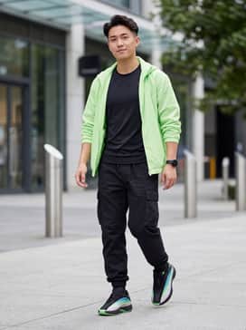 Nova Infinity Shoes – Black utility cargo joggers paired with a fitted black compression shirt and a neon green windbreaker to match the outsole.