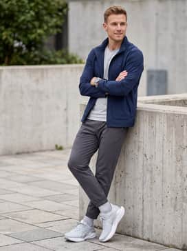 Novablast 5 Atc – A casual weekend outfit pairing slim-fit dark indigo jeans (slightly cuffed) with a crisp white graphic t-shirt and a navy blue utility jacket for a balanced, sporty street look.
