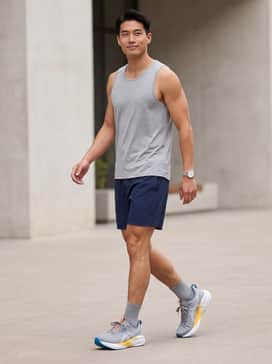 Novablast 5 – A pair of navy moisture-wicking athletic shorts paired with a light grey performance tank top for a high-intensity workout look.