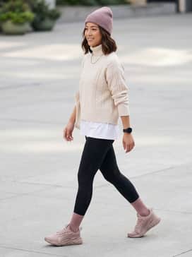 Pair with high-waisted black leggings, an oversized cream-colored cable knit sweater, and a matching rose-toned beanie for a cozy winter-to-spring transition.