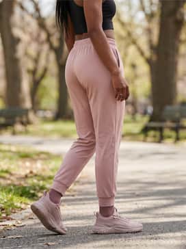 Pacer Future Street Animal Womens Animal Print Sneakers – Go for a monochromatic look with blush pink joggers, a fitted black athletic crop top, and a sleek high ponytail for a coordinated and sporty aesthetic.