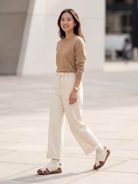 Pair with high-waisted, wide-leg cream trousers and a tucked-in tan cashmere sweater for a sophisticated monochromatic look that highlights the shoe's unique texture.