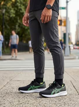 Patriot 14 – Slim-fit dark indigo jeans rolled at the cuff, a crisp white crew-neck tee, and a lightweight black bomber jacket for a sharp, casual urban aesthetic.