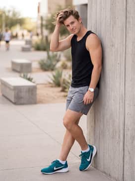 Grey heathered athletic shorts, a simple black tank top, and white no-show socks to let the vibrant teal color of the shoes stand out.