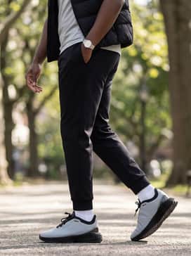 Porsche Design 3d Matrix Iii 3d Mtrx Iii – Premium black joggers, a fitted light grey t-shirt, and a sleek black puffer vest for a high-end weekend athleisure outfit.