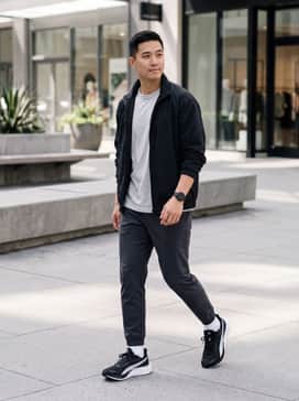 Pounce Lite – Lightweight black joggers paired with a crisp white graphic tee and a light-wash denim jacket for a relaxed urban vibe.