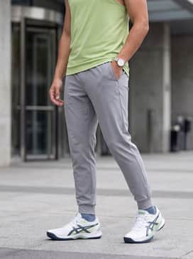 Powerbreak Ff – Light grey tapered joggers paired with a lime green athletic tank top that coordinates perfectly with the shoe's side paneling.