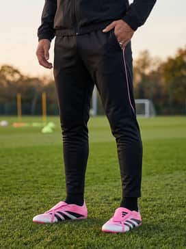 Predator League Foldover Tongue Firm Groundmulti Ground Football Boots Beckham – Training Drill Outfit: A sleek black tapered tracksuit with minimal pink detailing and a lightweight training jacket to keep the focus on the vibrant footwear.
