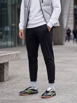 Predator Sala Shoes – Athletic Street Style: Combine the shoes with black tapered joggers, a crisp white tech-fleece hoodie, and a silver puffer vest to highlight the shoe's metallic details.