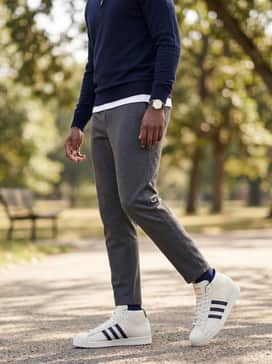 Pro Model Midcut Spikeless Golf Shoes – Smart-casual hybrid: Charcoal grey tapered joggers and a navy merino wool quarter-zip sweater layered over a plain white t-shirt for a sophisticated transition from range to restaurant.