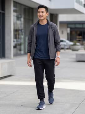 Questar 3 Running Shoes – A sleek performance look featuring tapered black joggers, a moisture-wicking navy fitted tee, and charcoal ankle socks.