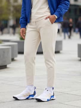 Rapidmove Adv 2 Training Shoes – Tailored cream joggers and a tucked-in oversized graphic tee, topped with a royal blue nylon bomber jacket to echo the shoe's accents.