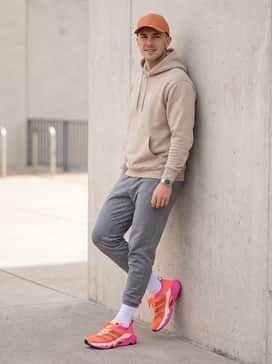 Rapidmove Pro Training Shoes – Casual Weekend: Combine with slim-fit light wash denim, a neutral sand-colored hoodie, and an orange baseball cap to pull the vibrant tones through the entire outfit.