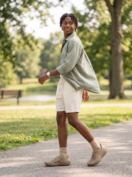Wear with cream-colored linen drawstring shorts and a sage green linen button-down shirt for a breathable, elevated summer-casual ensemble.