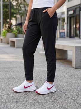 Tapered black joggers and a cropped white graphic hoodie with no-show socks for a comfortable day of errands.