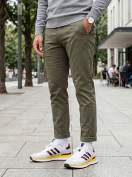 S2g 26 Textile Spikeless Golf Shoes – A casual weekend look featuring slim-fit olive chinos, a heather grey crewneck sweater, and a matching yellow baseball cap for a cohesive pop of color.
