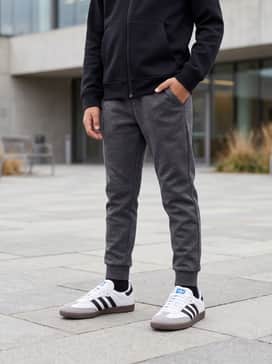 Style with charcoal grey tech-fleece joggers and a matching black zip-up hoodie for a sleek, monochromatic athletic ensemble.