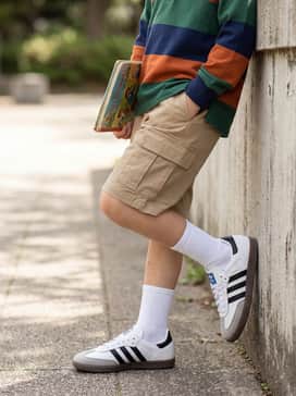 Combine with khaki cargo shorts and a colorful striped rugby shirt for a durable and stylish outfit perfect for weekend park adventures.