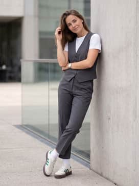 Combine with a pair of tailored charcoal grey trousers, a matching grey vest, and a white t-shirt underneath for a trendy business-casual streetwear ensemble.