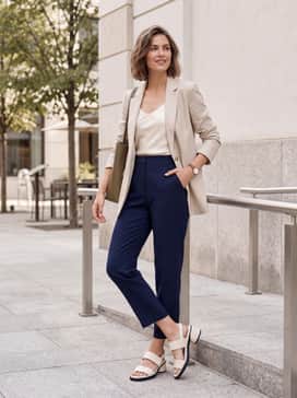 Sculpted Lx 35 – High-waisted straight-leg blue denim jeans and a simple navy silk camisole topped with a lightweight beige blazer.