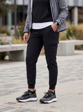 Seasons Voyage Nitro 3 Womens Trail Running Shoes – Black tapered cargo joggers styled with a white fitted technical tee and a sleek grey zip-up performance hoodie.