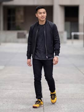 Sl72 Rs Jamaica X Bob Marley Shoes – Slim-fit black denim jeans paired with a faded vintage band t-shirt and a lightweight black bomber jacket for an edgy, concert-ready look.