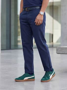 Smash 30 Mens Sneakers – Tapered khaki chinos matched with a navy blue polo and a matching gum-colored leather belt for a cohesive look.