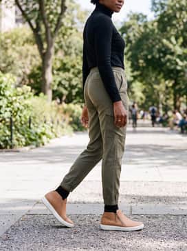 Wear with olive green utility joggers and a black fitted turtleneck for a clean, streetwear-inspired aesthetic.