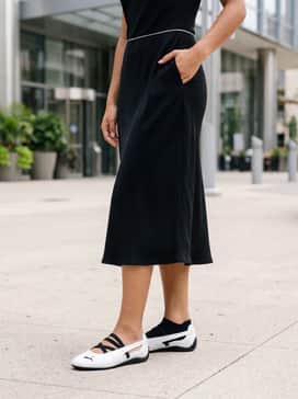 Style with a black midi slip dress and a thin silver waist chain to emphasize the shoe's sleek silhouette and motorsport heritage.