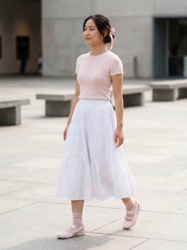 Speedcat Ballet Venus Womens Sneakers – A white tiered midi skirt paired with a fitted pastel-colored pointelle knit top and delicate ribbon hair accessories for a full ballet-inspired look.
