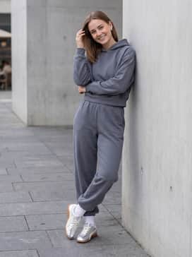 Monochrome slate grey high-waisted joggers and a matching cropped hoodie for an elevated, sleek loungewear ensemble that highlights the metallic finish.