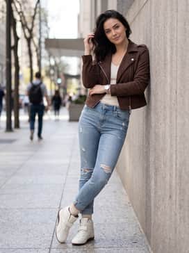 Distressed light-wash skinny jeans with a tucked-in white ribbed tank and a chocolate brown faux-suede biker jacket to match the shoe's sole.