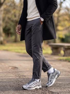 Wear with dark grey chinos, a tucked-in cream mock-neck sweater, and a structured black overcoat to bridge the gap between sportswear and smart-casual.