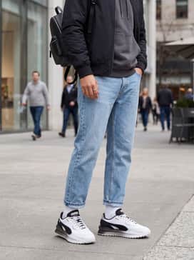 Style Rider Zinc – Light-wash straight-leg denim jeans with a charcoal grey hoodie and a black bomber jacket for a layered, casual city look.