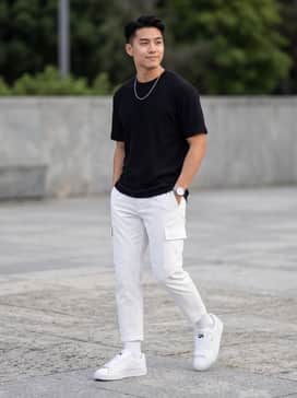 Suede Xl Leather – Oversized white cargo pants paired with a fitted black ribbed tank top and a silver chain necklace to lean into a clean, monochromatic streetwear aesthetic.
