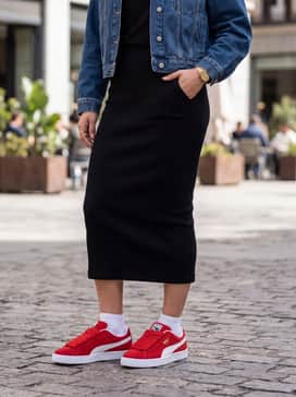A black ribbed midi dress with a cropped denim jacket and gold jewelry to highlight the shoe's metallic accents.