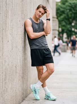 Swiftace Yuki – Black mesh basketball shorts worn with a fitted moisture-wicking charcoal tank top and white crew socks to lean into the shoe's performance roots.