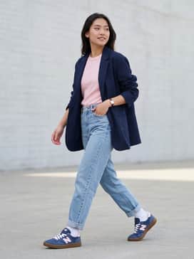 Pair these sneakers with high-waisted light-wash straight-leg jeans, a tucked-in soft pink baby tee, and an oversized navy blazer for a balanced smart-casual ensemble.